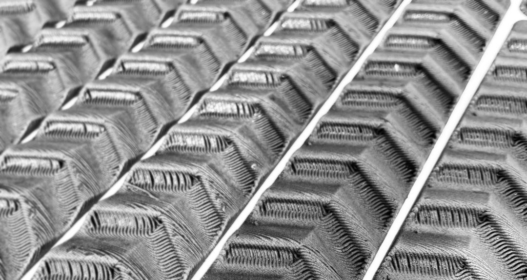 Black traction pad close-up showing wave pattern